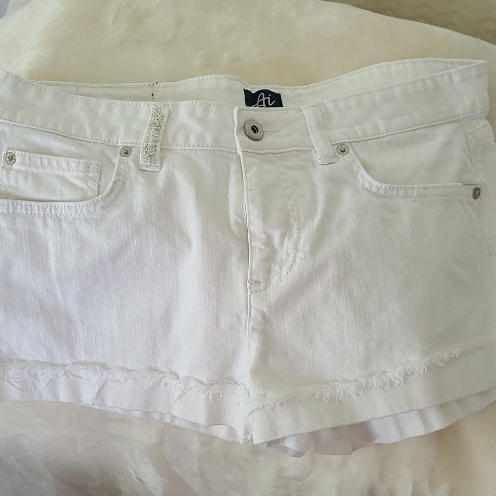 Authentic Icon white shorts with red stars .